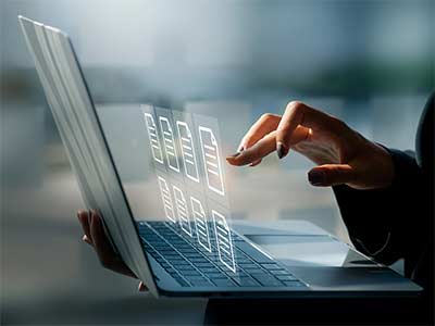 woman researching on laptop