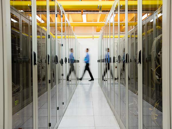 man walking in server room