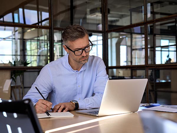 man working at laptop