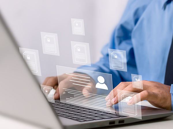 person typing on laptop