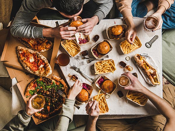 group of friends eating takeaway