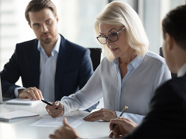 3 people in a meeting