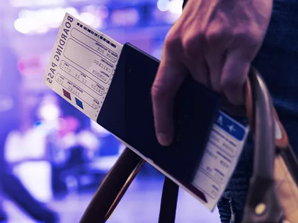 hand holding boarding pass