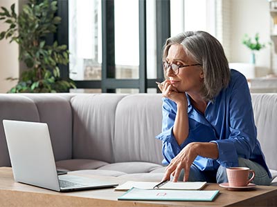 woman looking at laptop